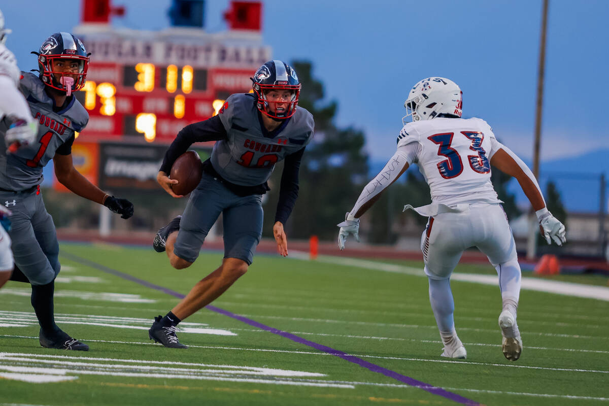 Coronado Quarterback Aiden Krause (10) runs out of the pocket for a gain during a football game ...