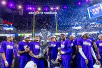 The Washington Huskies celebrate their Pac-12 football championship game win against the Oregon ...