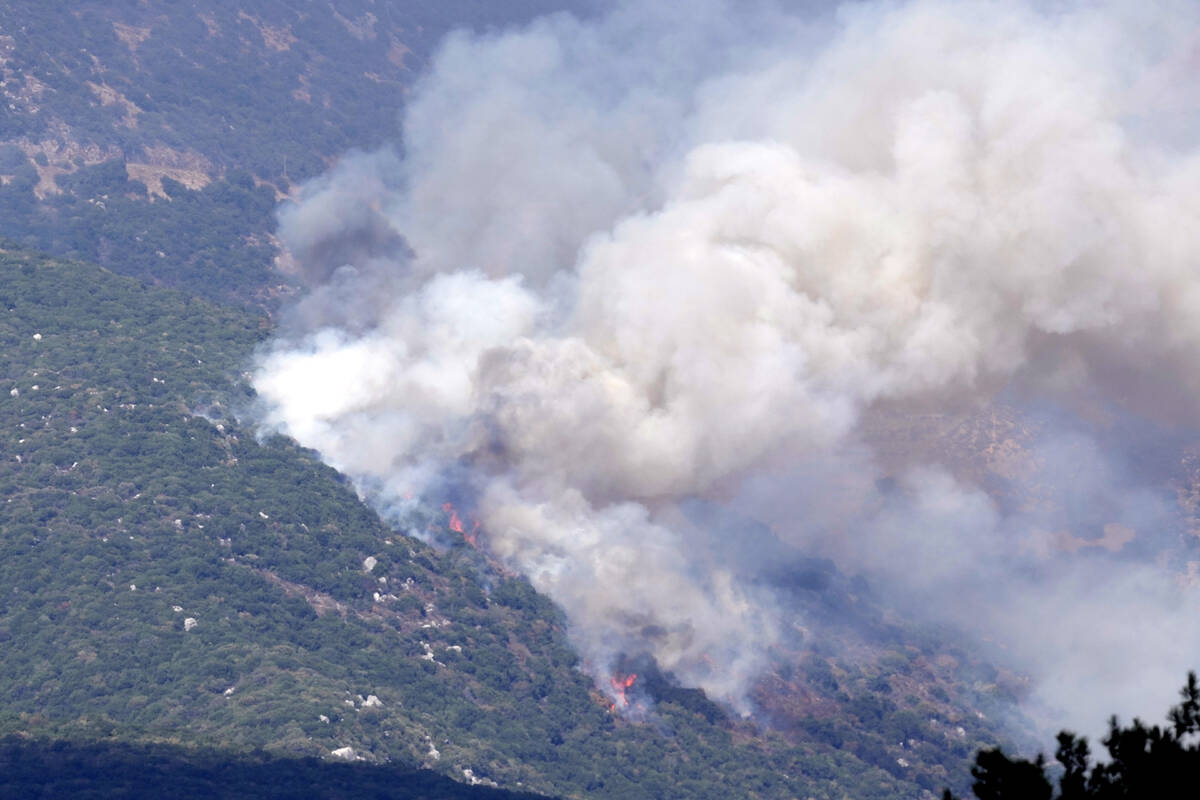 Smoke rises from Israeli shelling in Jabal al-Rihan, seen from the southern Lebanese town of Ma ...