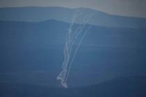 Israeli Iron Dome air defense system fires to intercept rockets that were launched from Lebanon ...