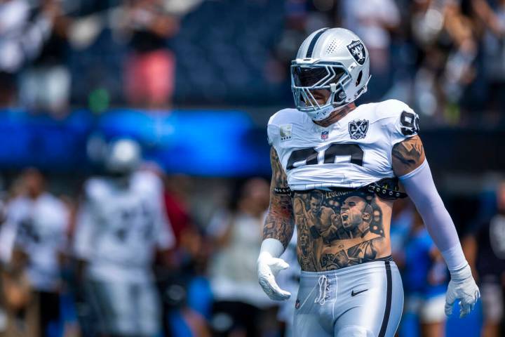 Raiders defensive end Maxx Crosby (98) walks the field as they warm up to face the Los Angeles ...