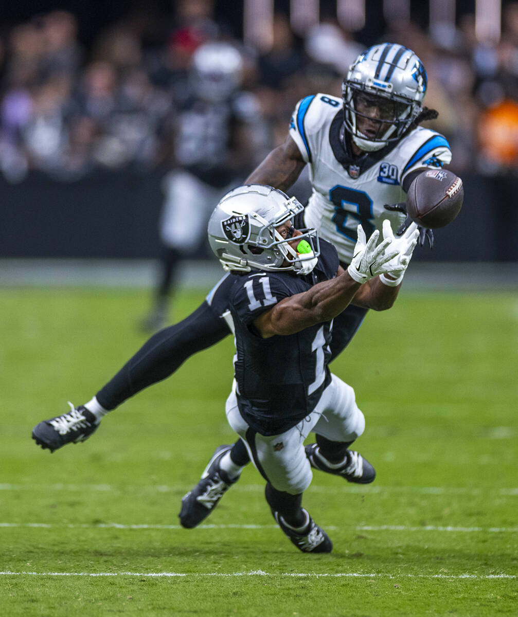 Raiders wide receiver Tre Tucker (11) dives for a long pass attempt over Carolina Panthers corn ...