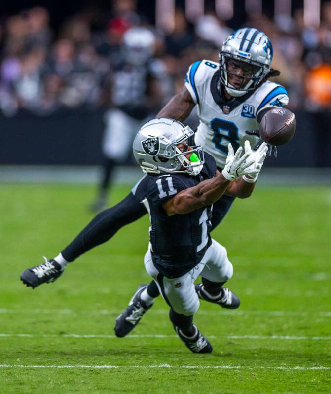 Raiders wide receiver Tre Tucker (11) dives for a long pass attempt over Carolina Panthers corn ...