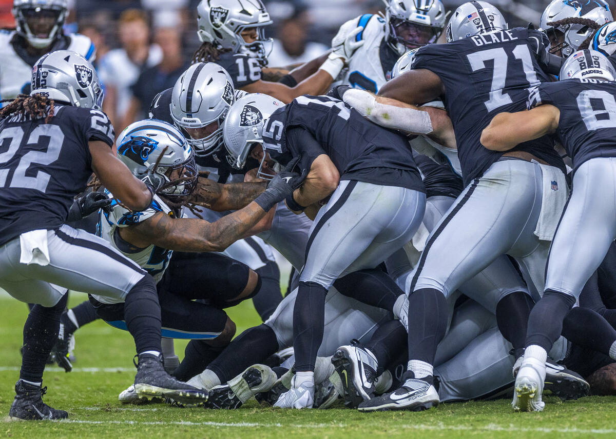 Raiders quarterback Gardner Minshew (15) is sacked by Carolina Panthers linebacker Shaq Thompso ...