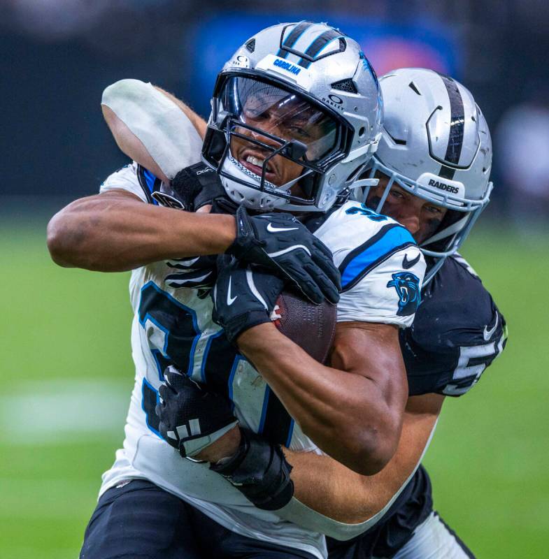 Carolina Panthers running back Chuba Hubbard (30) is taken down from behind after a reception b ...