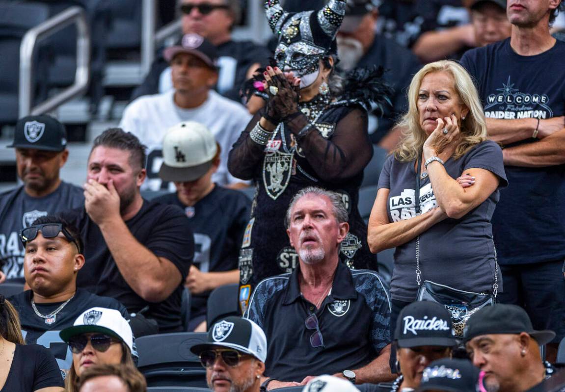 Raiders fans sit dismayed as the Carolina Panthers dominate during the first half of their NFL ...