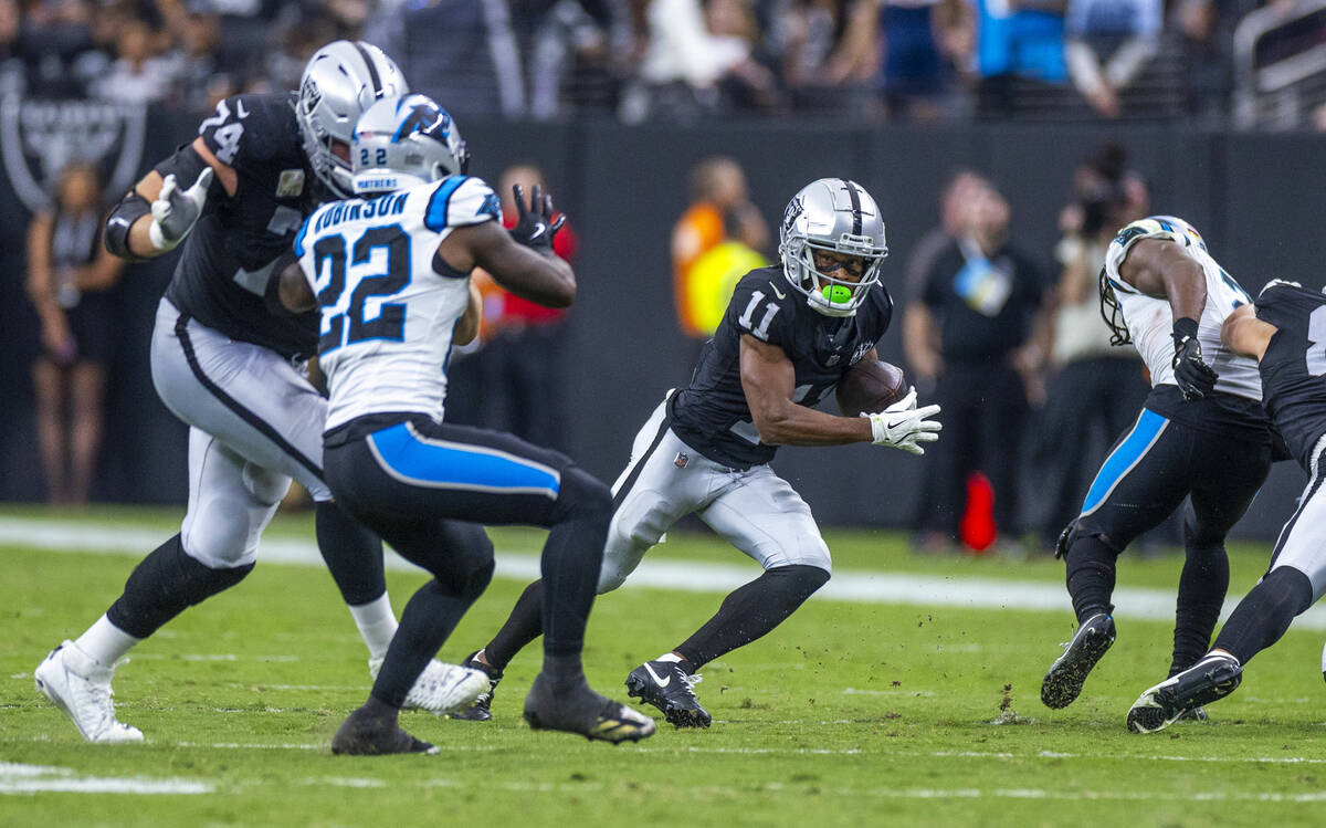 Raiders wide receiver Tre Tucker (11) looks for more yards after a reception against the Caroli ...