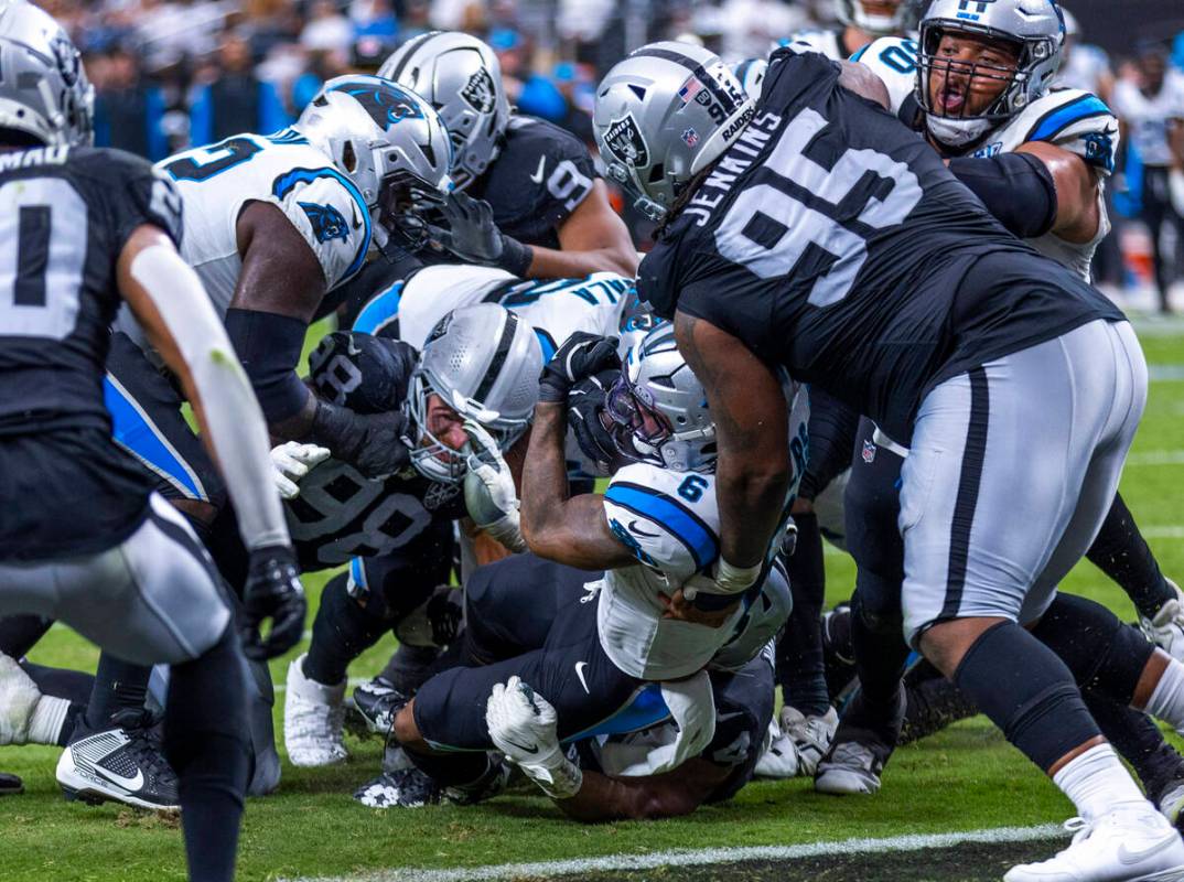 Carolina Panthers running back Miles Sanders (6) falls into the end zone against Raiders defens ...