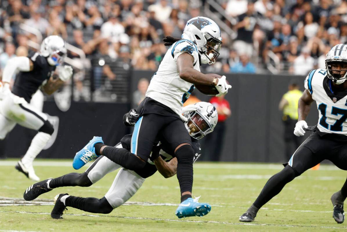 Raiders cornerback Jack Jones (18) takes down Carolina Panthers wide receiver Diontae Johnson ( ...