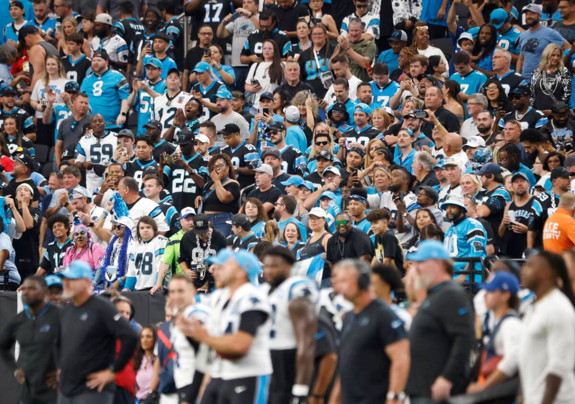 Carolina Panthers fans cheer for their team during an NFL football game against Raiders at Alle ...