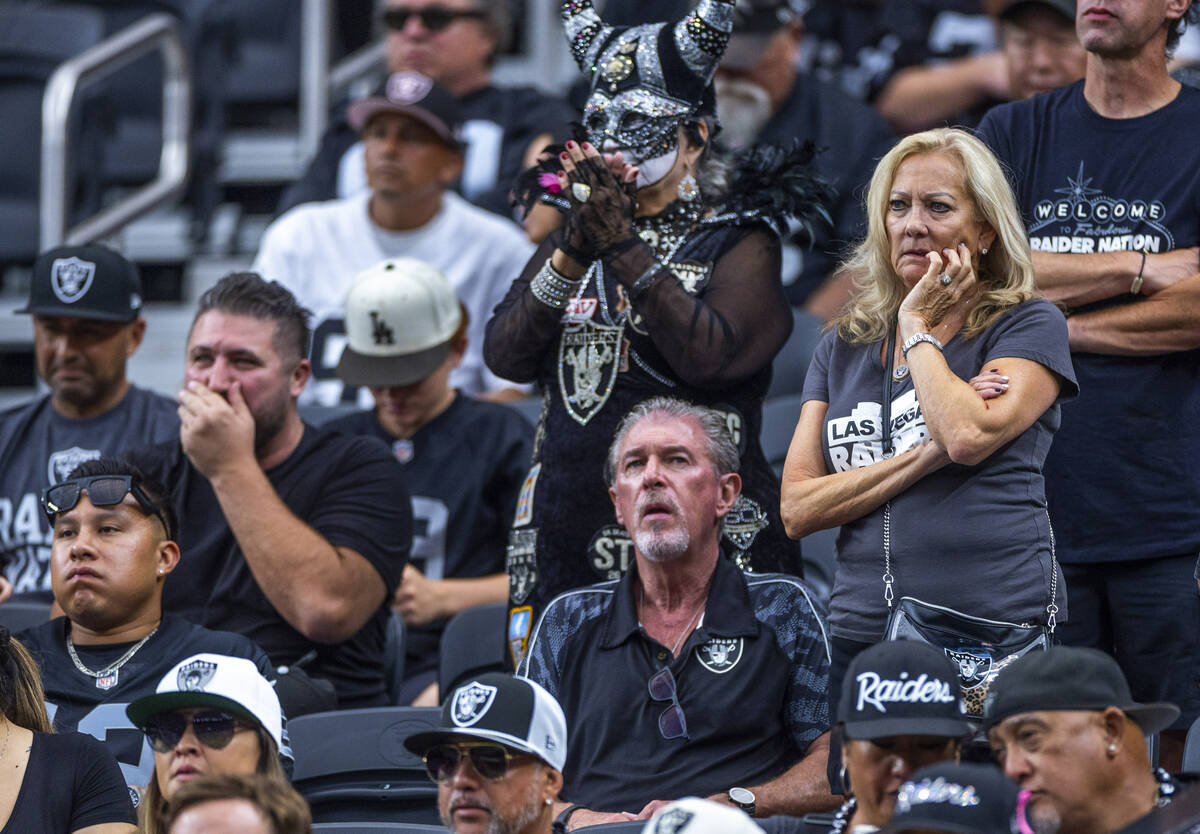 Raiders fans sit dismayed as the Carolina Panthers dominate during the first half of their NFL ...