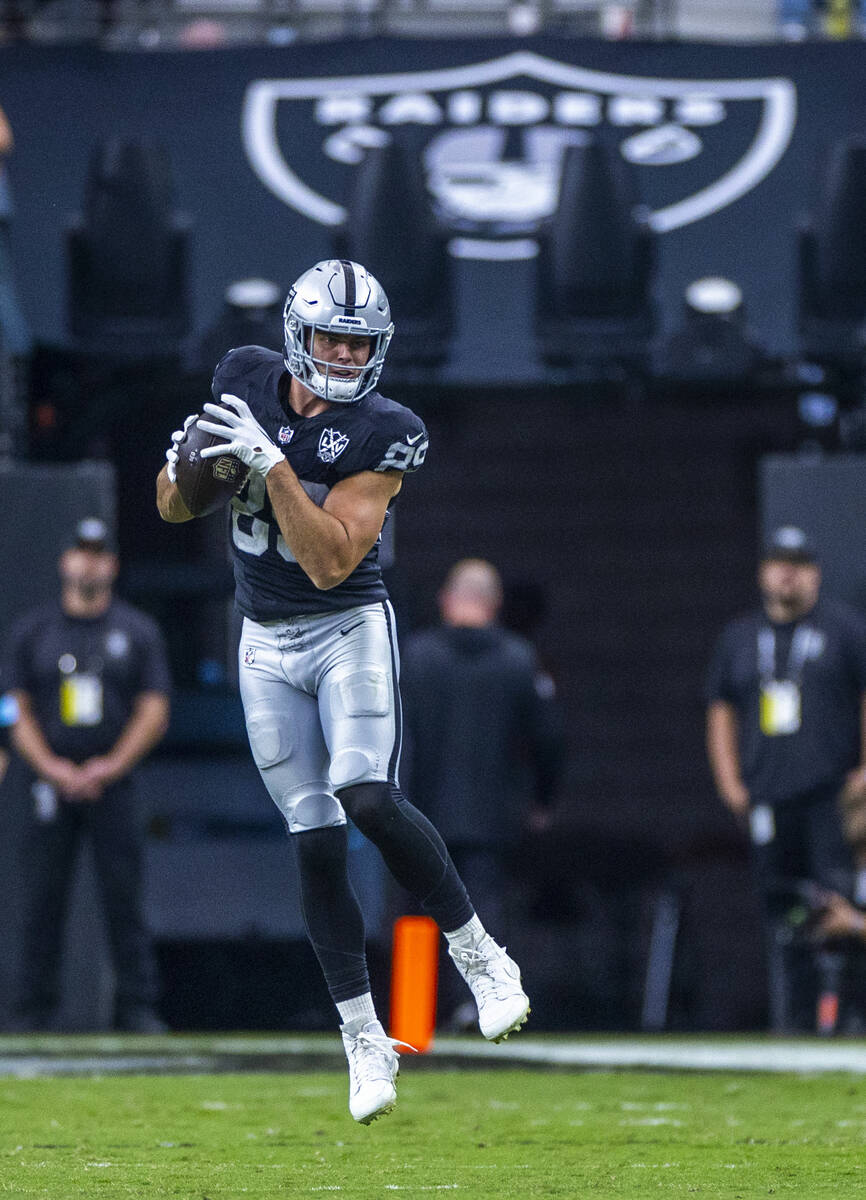 Raiders tight end Brock Bowers (89) elevates for a reception over the Carolina Panthers during ...