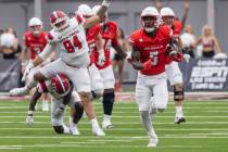 UNLV running back Greg Burrell (5) runs with the ball during the college football game against ...