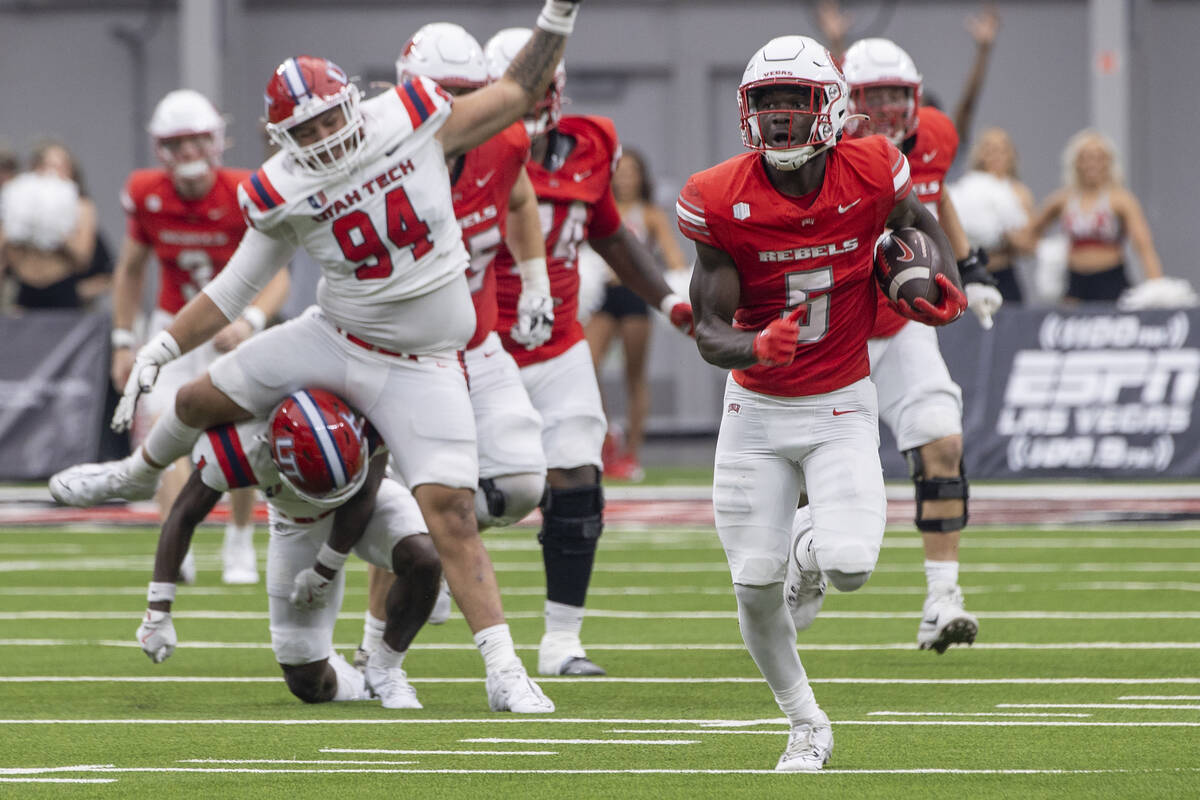 UNLV running back Greg Burrell (5) runs with the ball during the college football game against ...