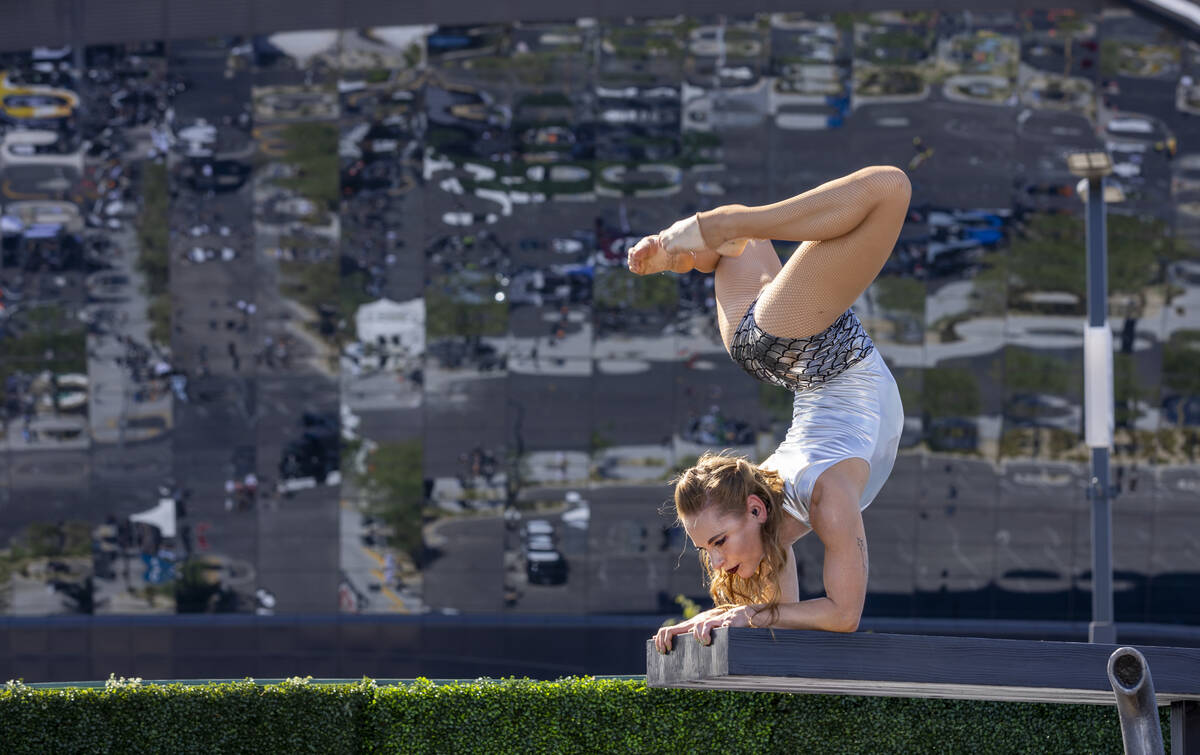 A contortionist performs for fans in the new Raiders Pregame Masqueraid venue in the tailgate b ...