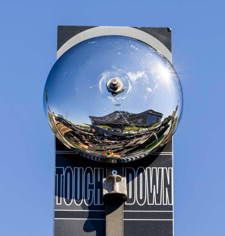 A fan rings the bell in a High Striker game in the new Raiders Pregame Masqueraid venue in the ...