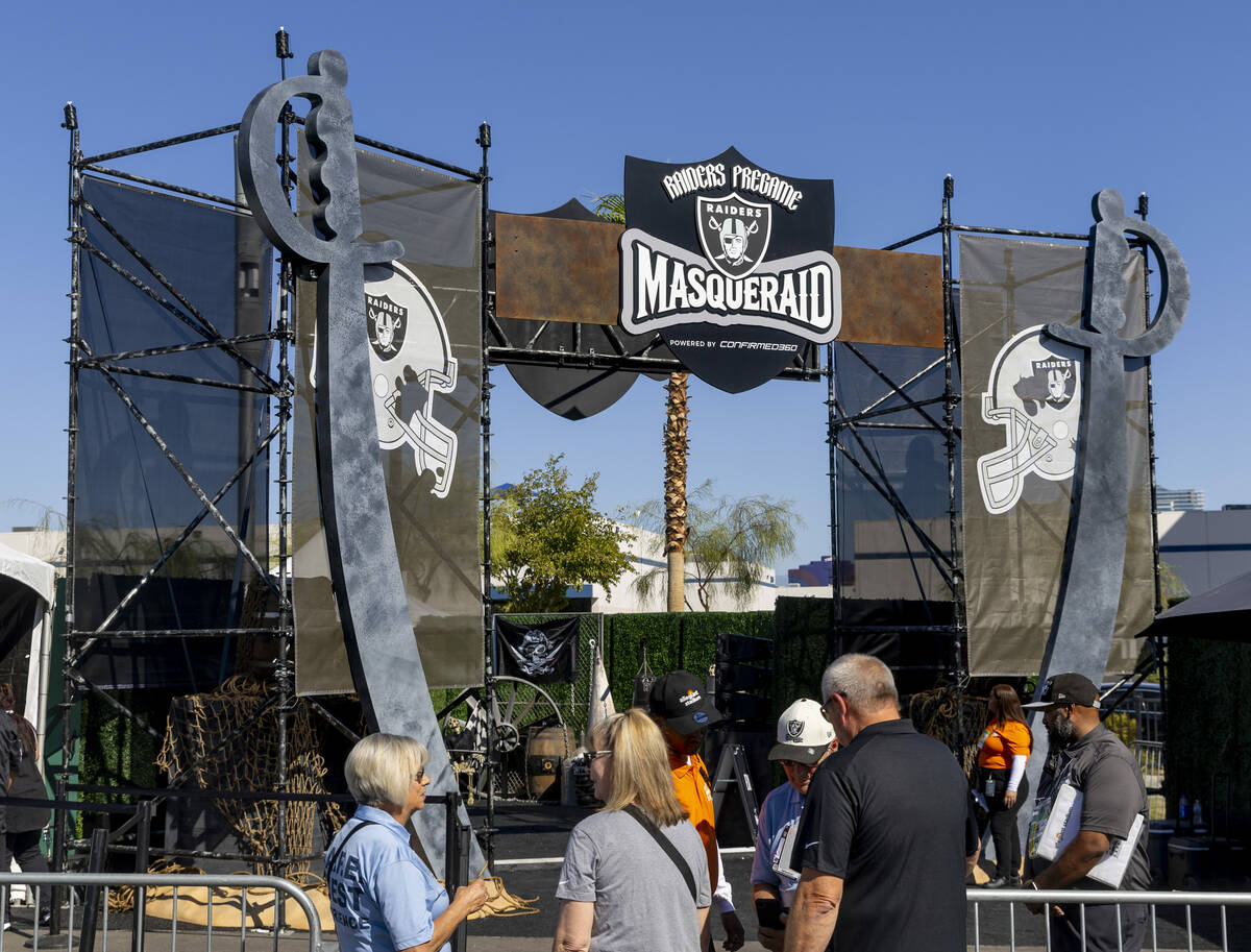 Fans enter the new Raiders Pregame Masqueraid venue in the tailgate before the first half of th ...