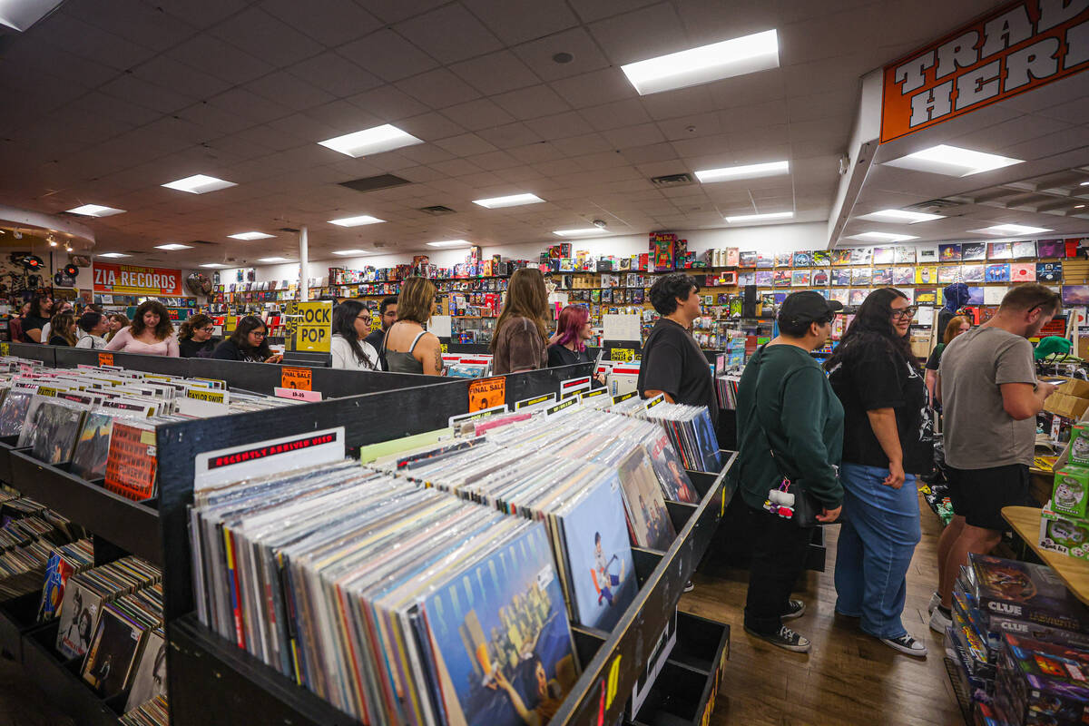 Fans line up to enter a raffle for a chance to win Chappell Roan merch during a listening party ...