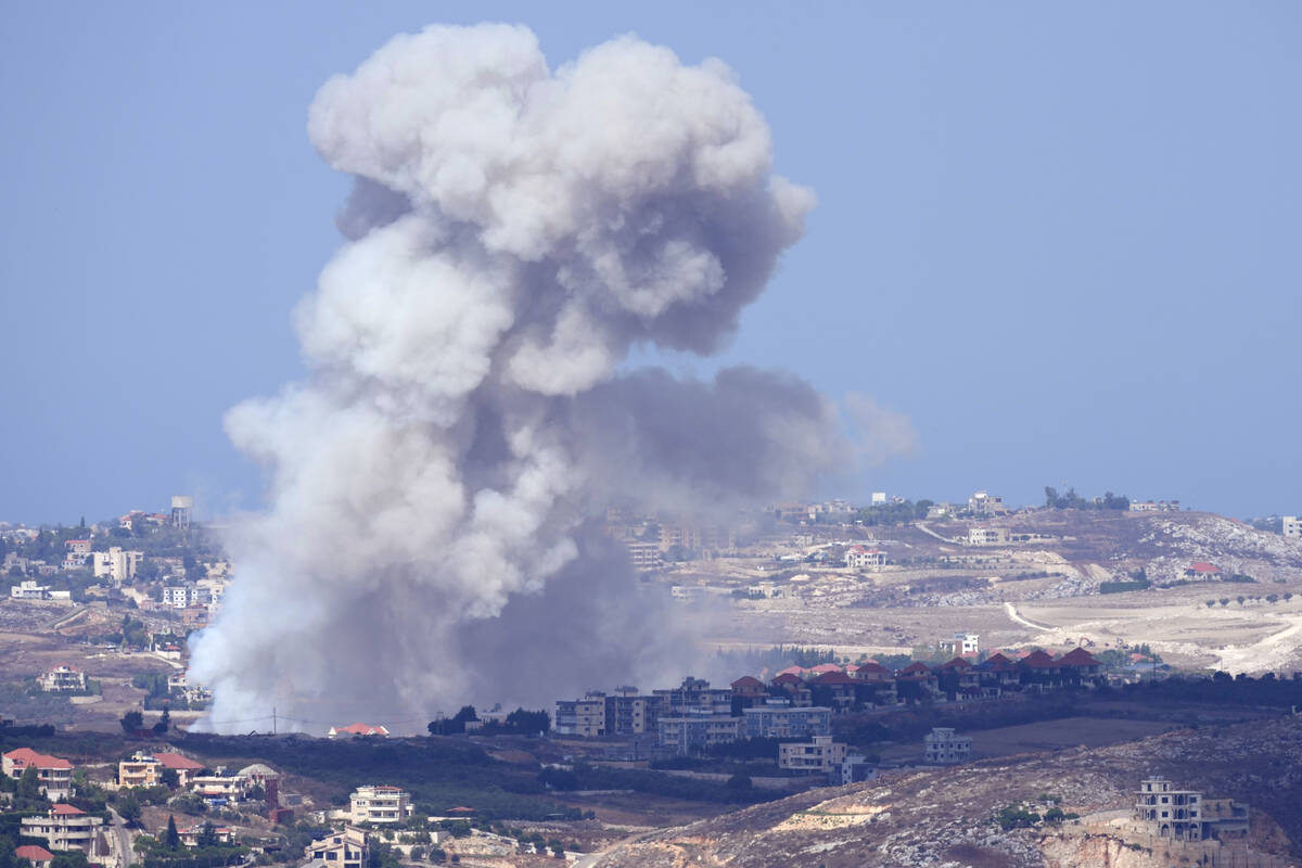 Smoke rises from Israeli airstrikes on villages in the Nabatiyeh district, seen from the southe ...