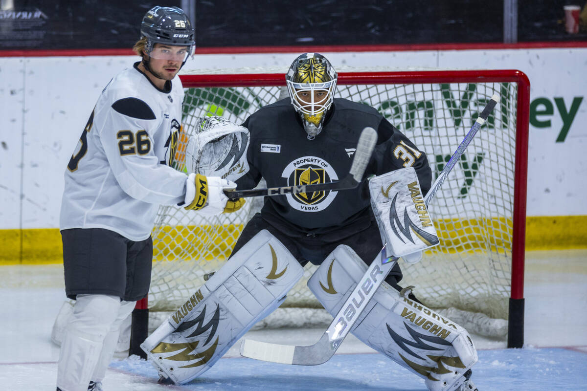 Vegas Golden Knights forward Alexander Holtz (26) looks for a shot attempt near goaltender Isai ...