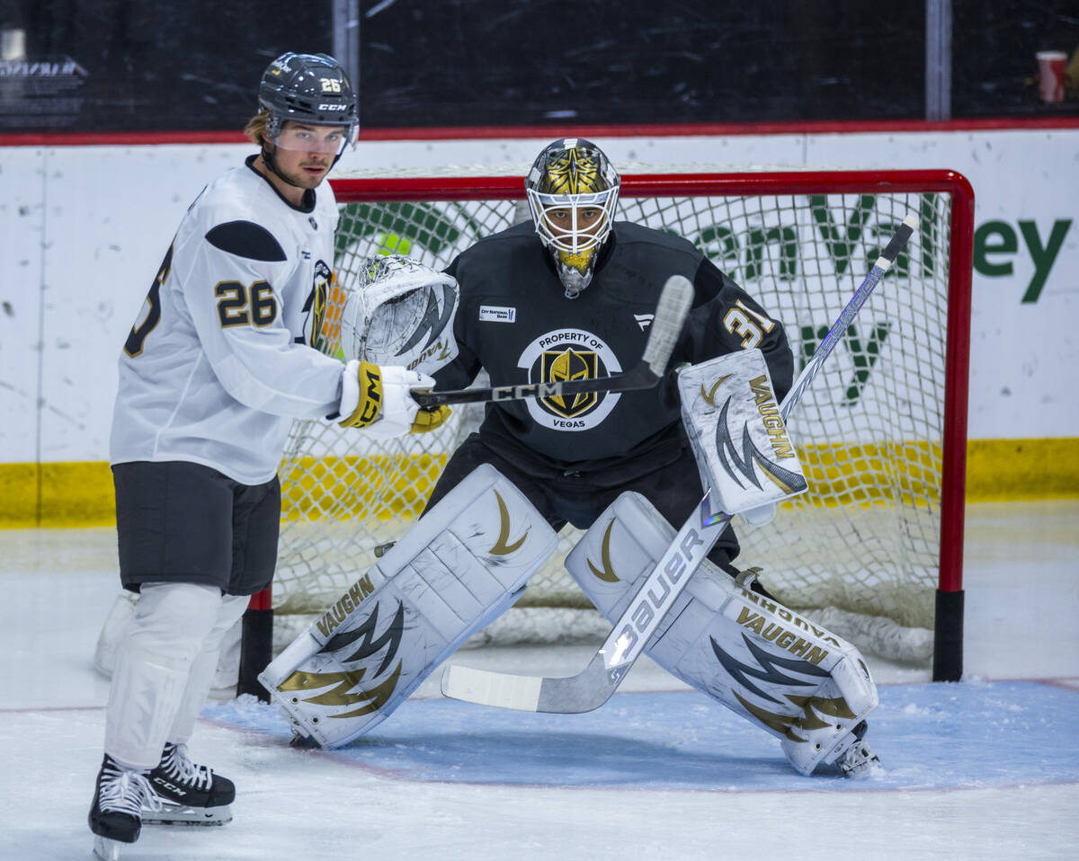 Vegas Golden Knights forward Alexander Holtz (26) looks for a shot attempt near goaltender Isai ...