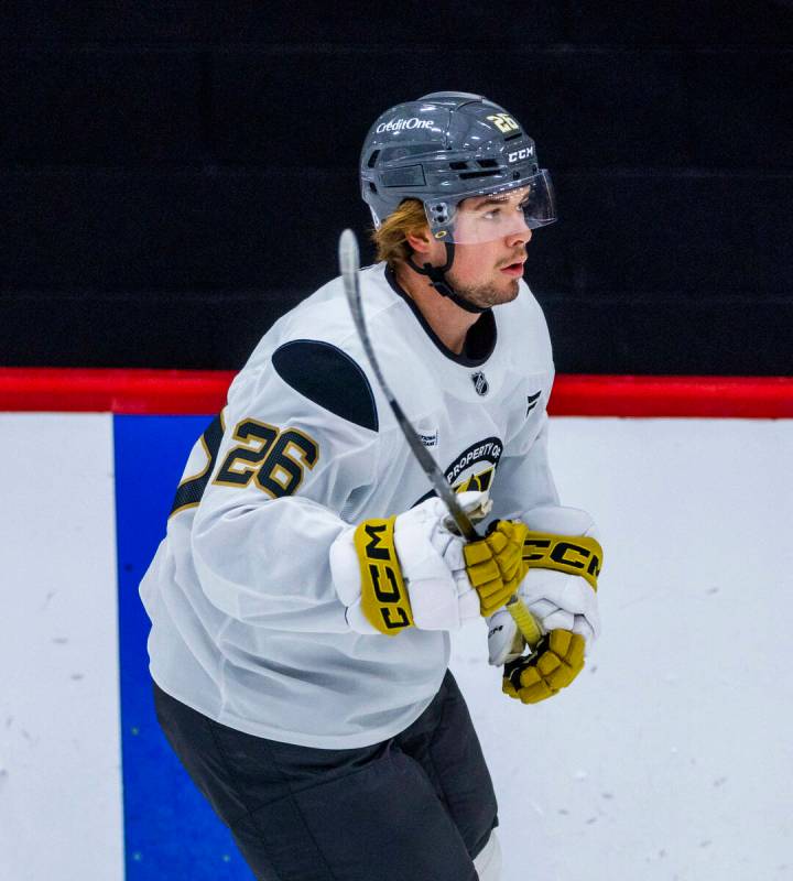 Golden Knights forward Alexander Holtz (26) reacts to a drill during training camp at City Nati ...