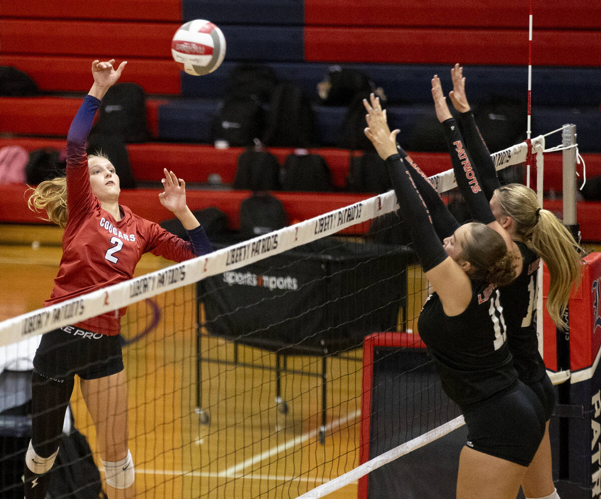 Coronado junior Julie Beckham (2) spikes the ball during the high school volleyball game agains ...