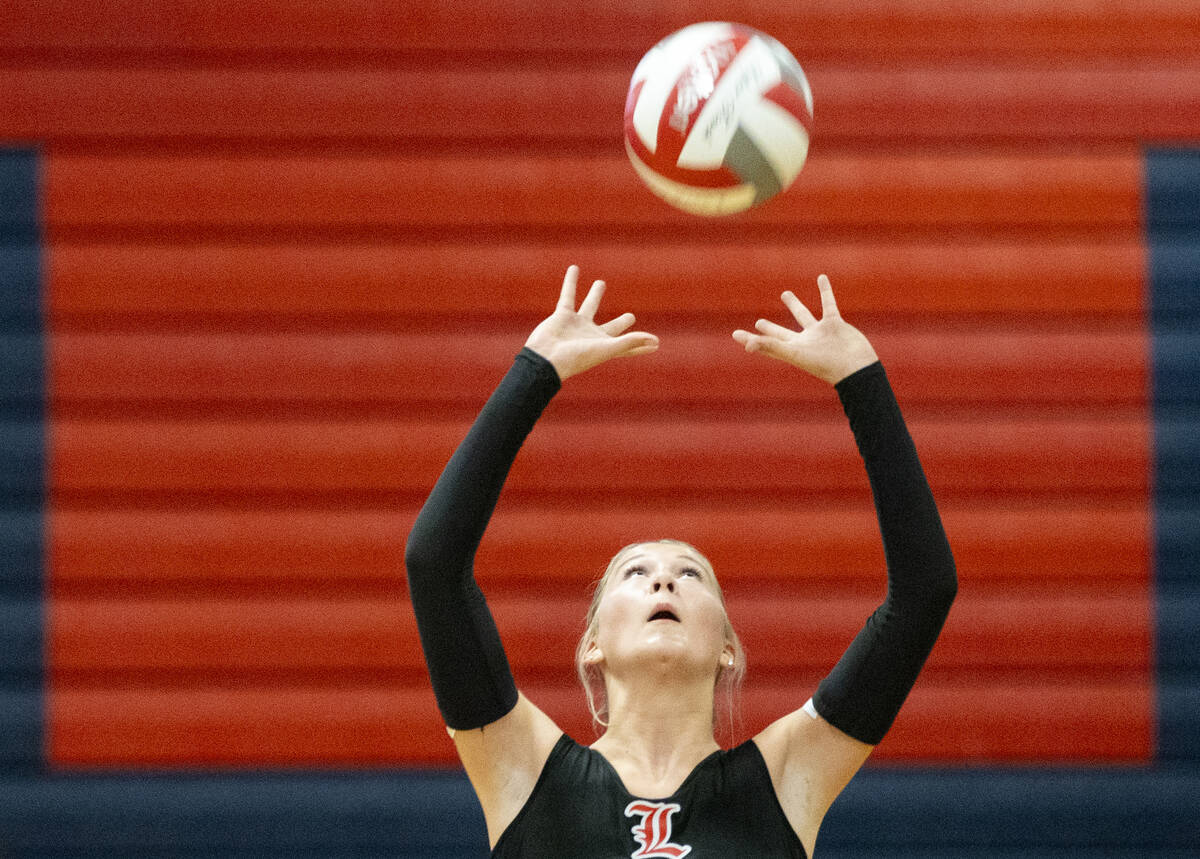 Liberty sophomore Addison Jones (14) competes during the high school volleyball game against Co ...