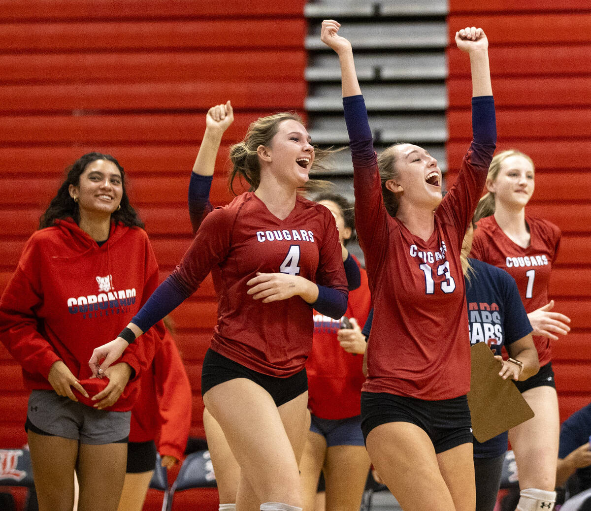 The Coronado bench runs out onto the court to celebrate after winning the high school volleybal ...