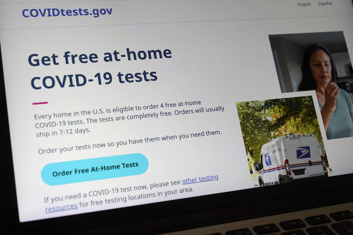 A United States government website, COVIDTests.gov, is displayed on a computer, Jan. 19, 2022, ...