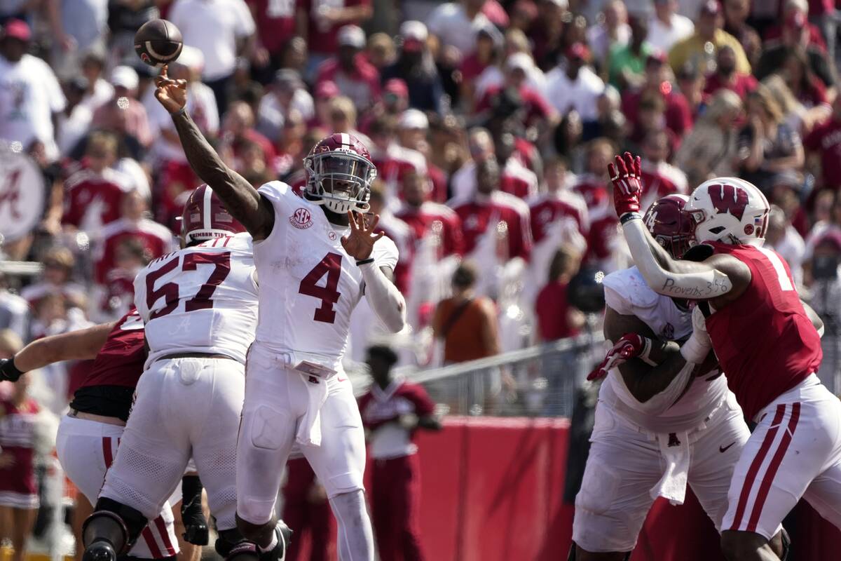 Alabama's Jalen Milroe (4) thorws a pass during the second half of an NCAA college football gam ...