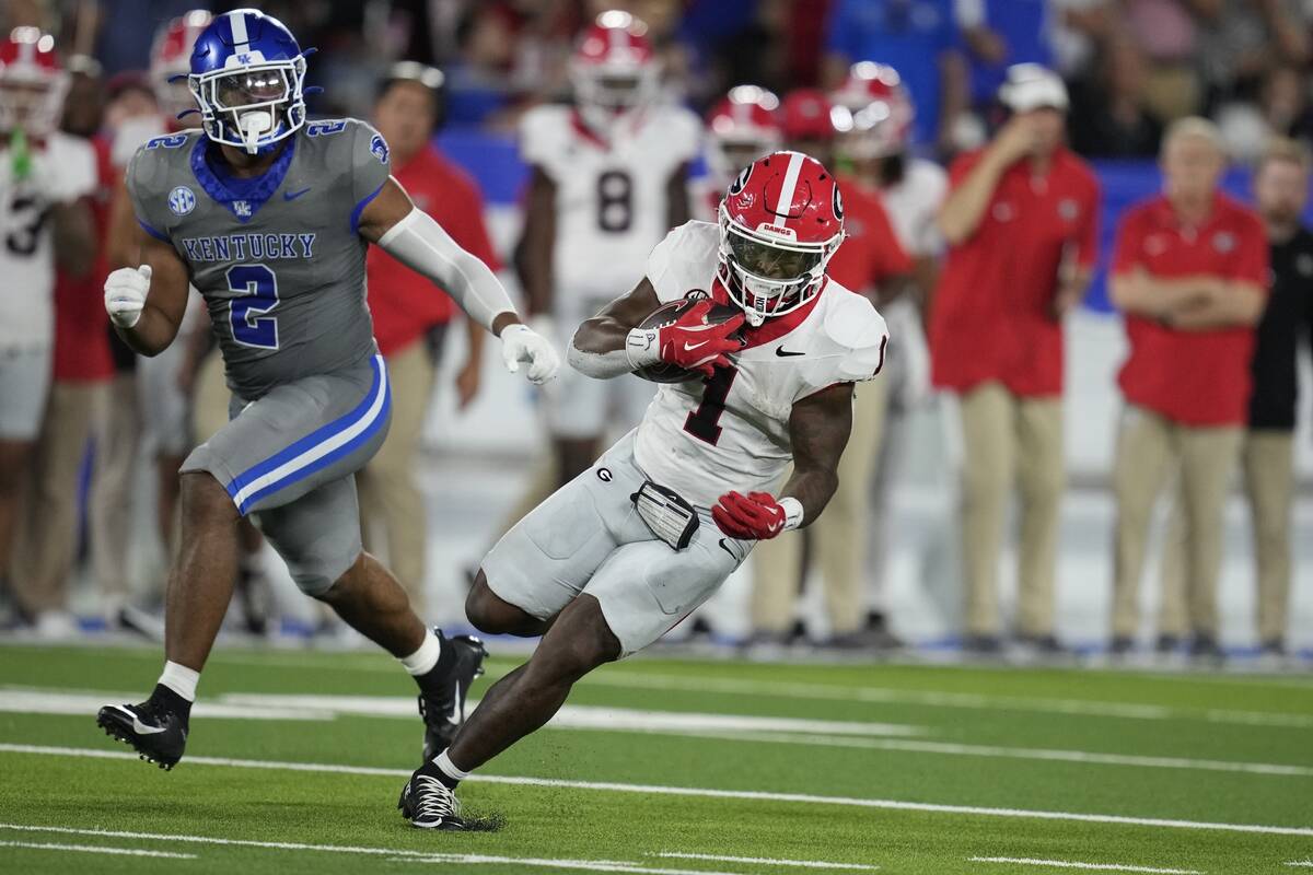 Georgia running back Trevor Etienne runs during the second half of an NCAA college football gam ...