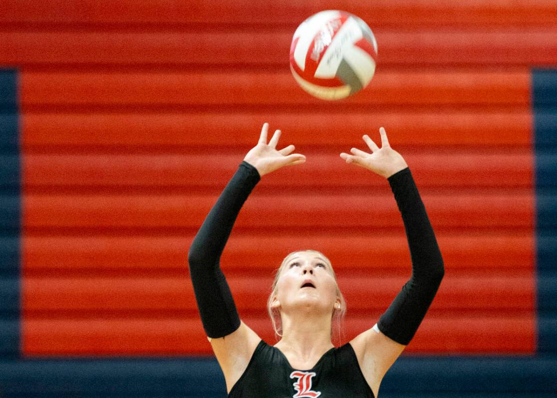 Liberty sophomore Addison Jones (14) competes during the high school volleyball game against Co ...