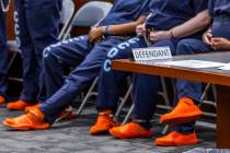 FILE - Defendants from the Clark County Detention Center are shackled in a court room at the Re ...