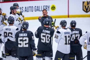 Golden Knights Head Coach Bruce Cassidy speaks to his players on the ice during the first day o ...