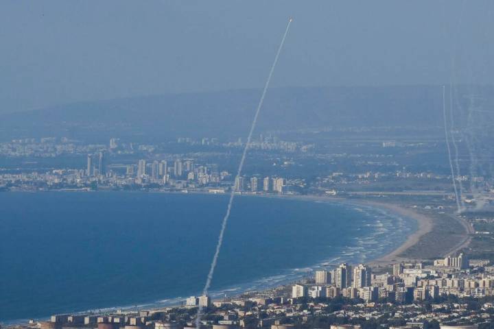 Israeli Iron Dome air defense system fires to intercept rockets that were launched from Lebanon ...