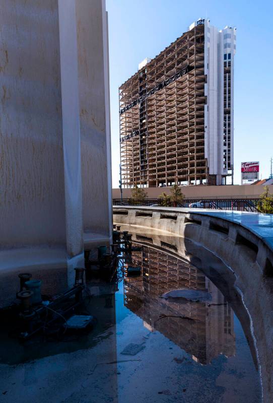 One of the towers is reflected in MGM Grand fountain water as preparations for the upcoming imp ...