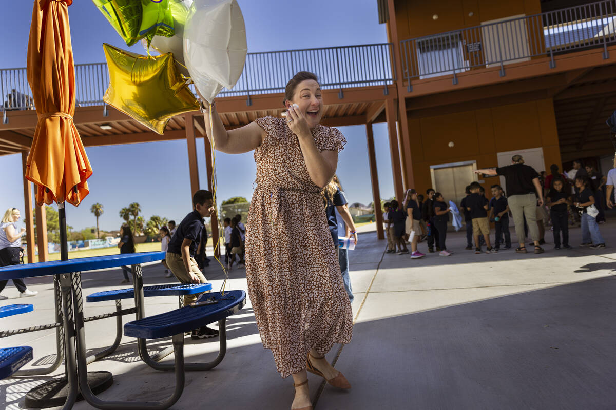 Pre-K teacher Leigh Todd of Tate Elementary School reacts after being named early educator of t ...