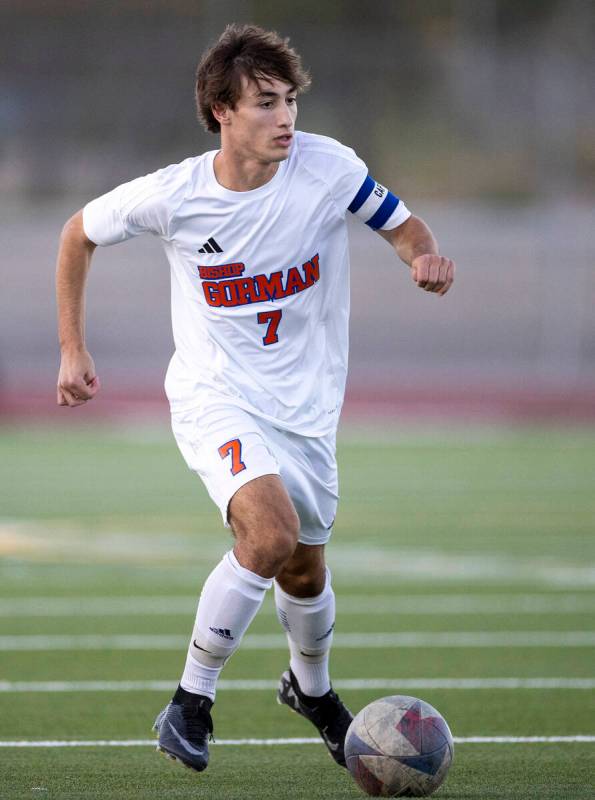 Bishop Gorman midfielder Maddix Bordinhao (7) runs with the ball during the high school soccer ...