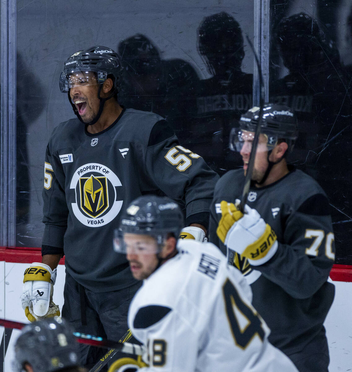 Golden Knights right wing Keegan Kolesar (55) laughs at teammates on the ice during training ca ...