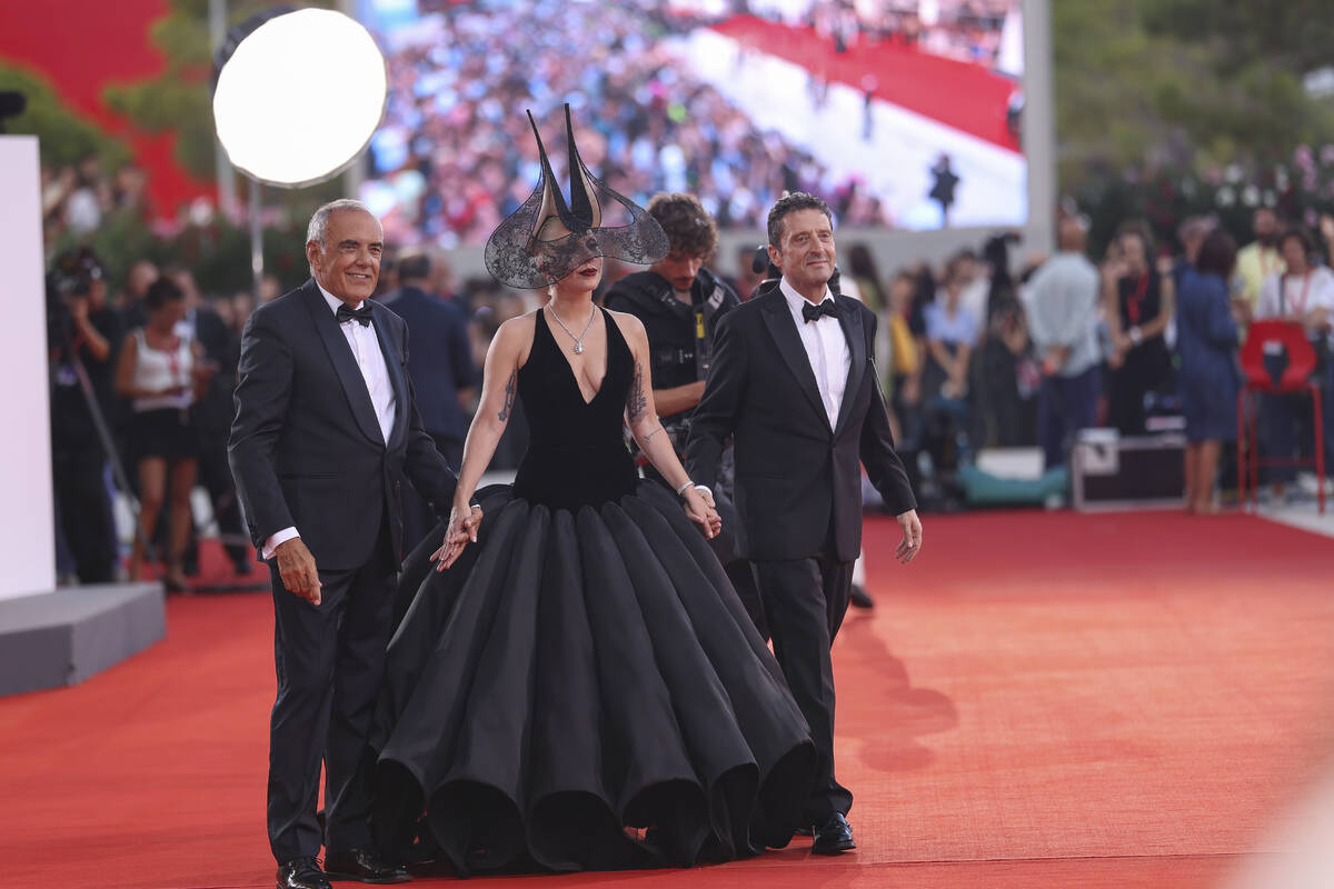 Venice Film Festival Artistic Director Alberto Barbera, from left, Lady Gaga and Pietrangelo Bu ...