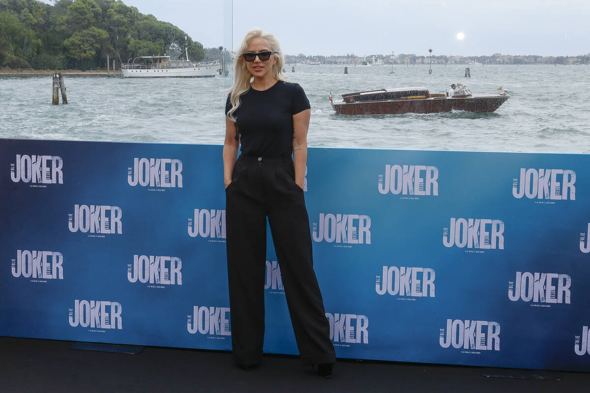 Lady Gaga poses for photographers at the photo call for the film 'Joker: Folie A Deux' at the h ...