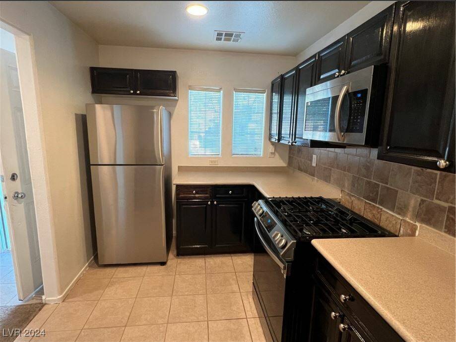 9125 Careful Canvas Ave. is located in Centennial and is listed for $329,000. The kitchen has s ...