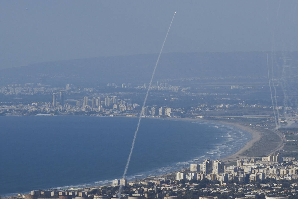 Israeli Iron Dome air defense system fires to intercept rockets that were launched from Lebanon ...