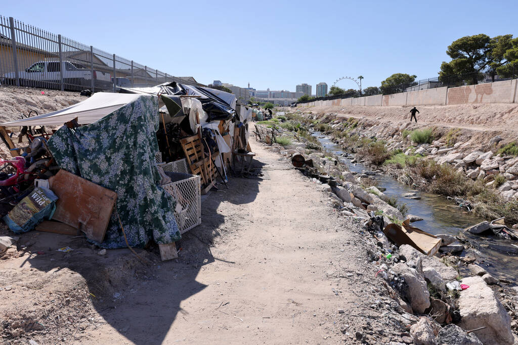 FILE - People camp along the Tropicana Wash near University Center Drive east of the Strip in L ...