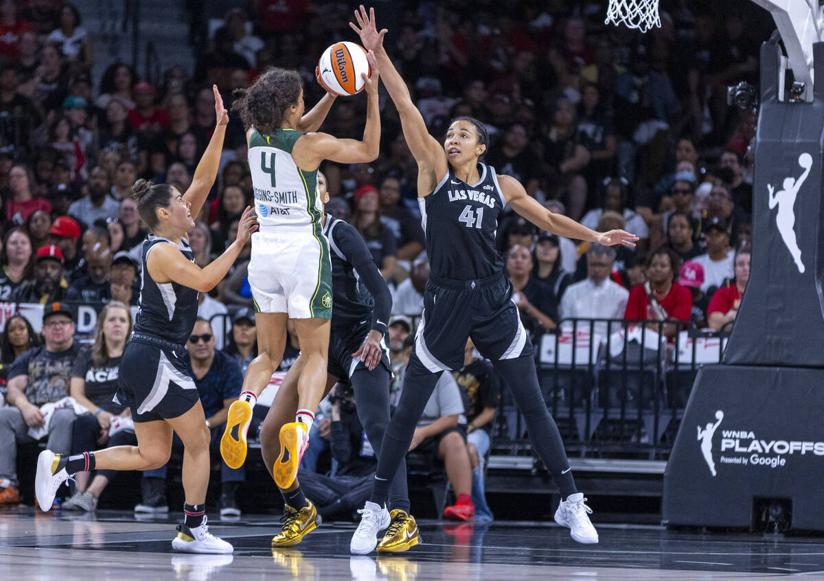 Aces center Kiah Stokes (41) sets up to block a shot attempt by Seattle Storm guard Skylar Digg ...