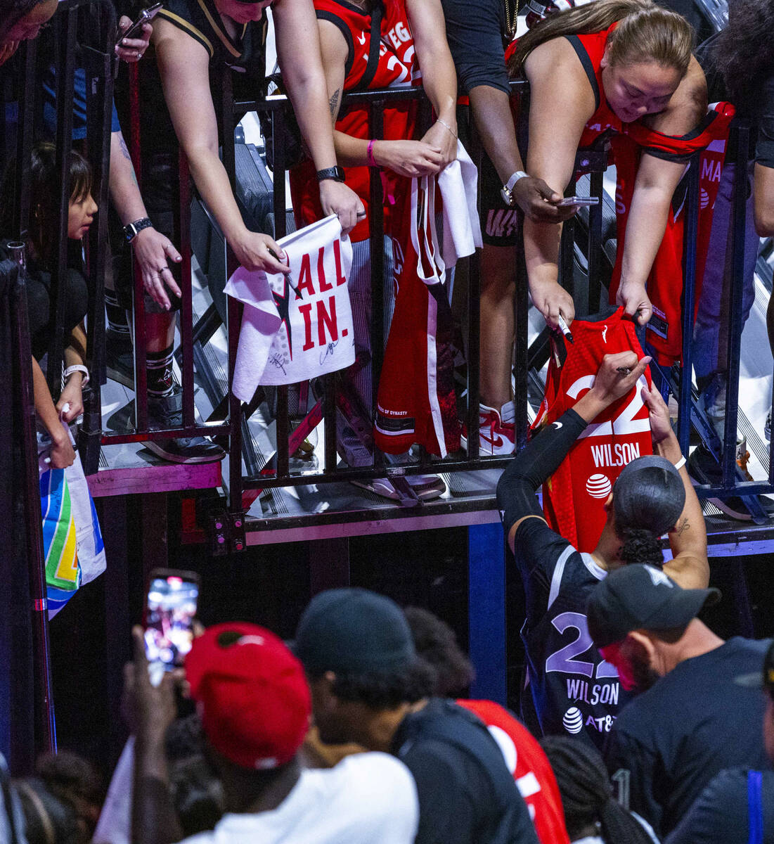 Aces center A'ja Wilson (22) signs autographs following the win over the Seattle Storm in their ...