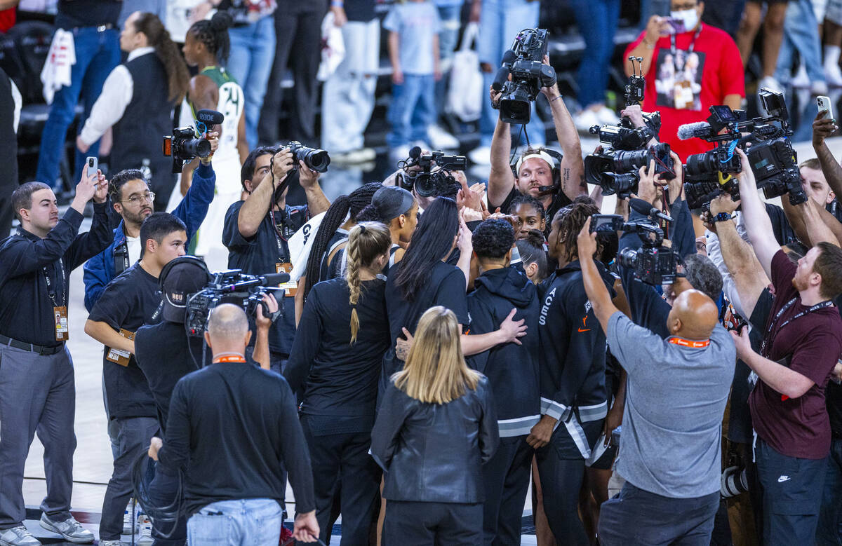 Aces players are mobbed by the media following their win over the Seattle Storm in their WNBA p ...