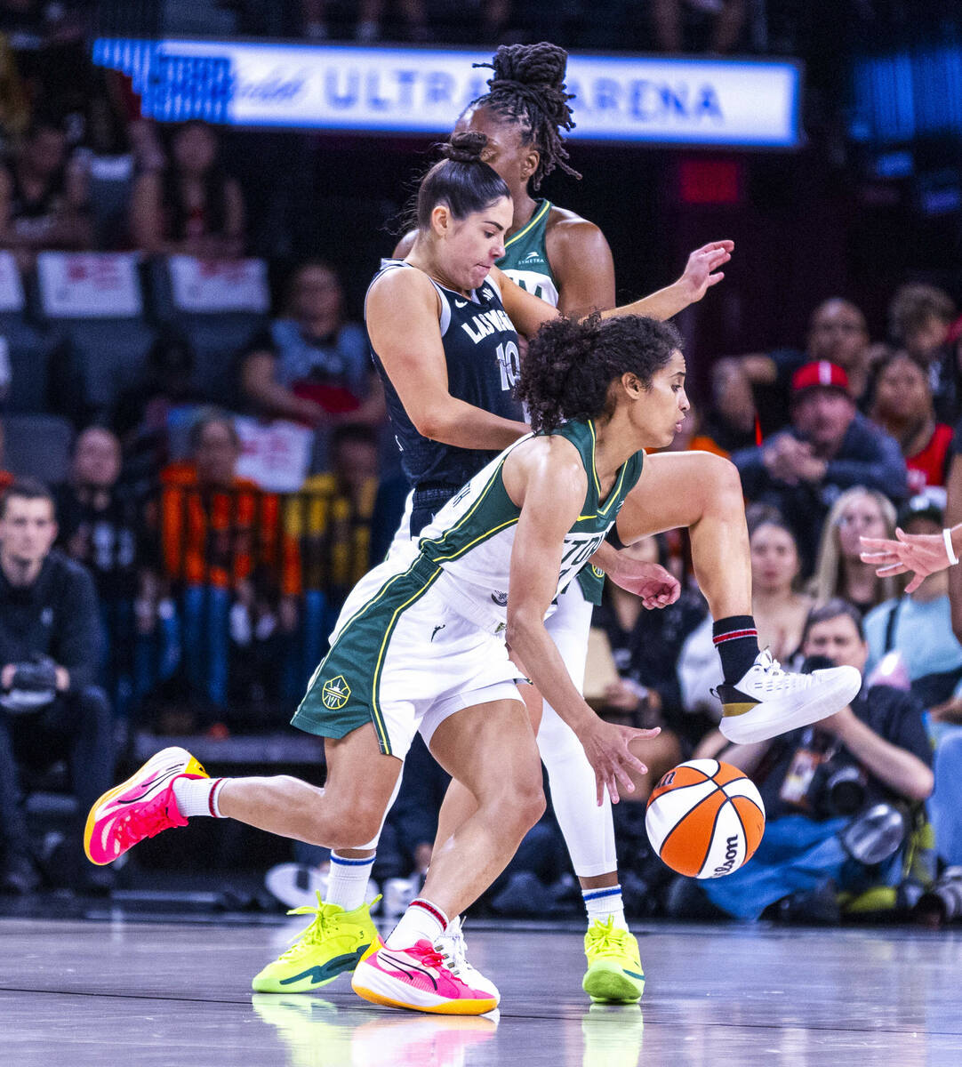 Seattle Storm guard Skylar Diggins-Smith (4) rolls past Aces guard Kelsey Plum (10) who gets pi ...