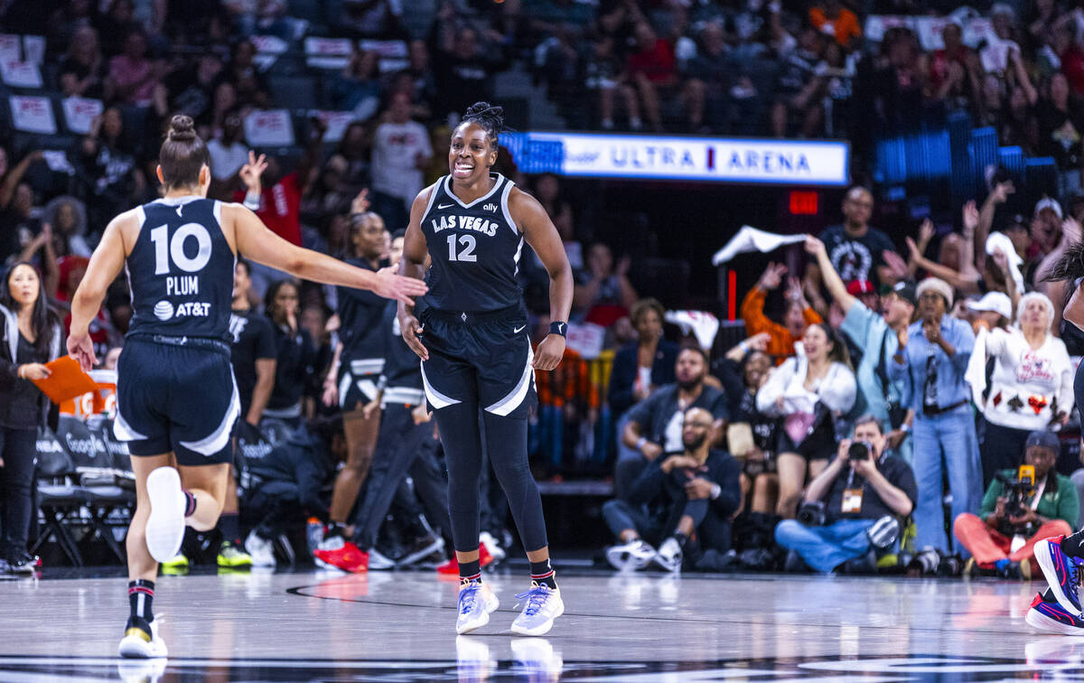 Aces guard Kelsey Plum (10) and guard Chelsea Gray (12) celebrate another three-point basket ag ...